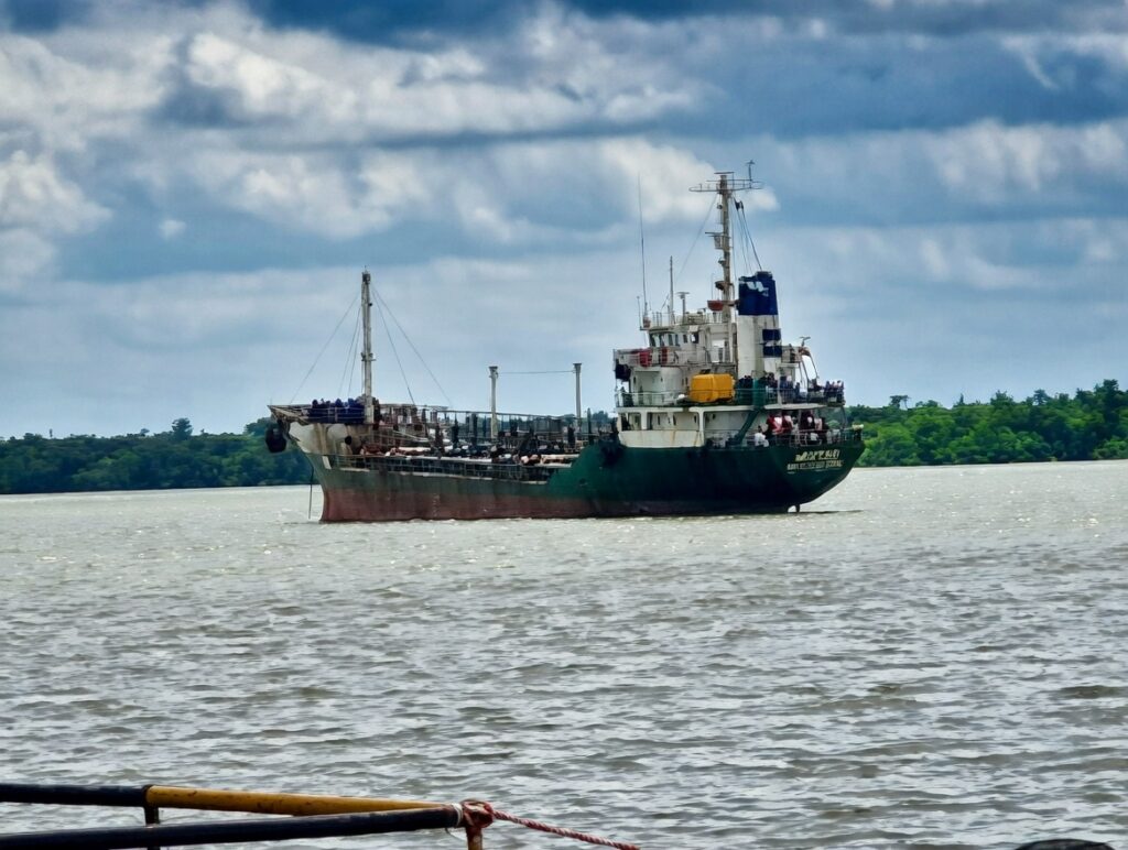 A side-view of the arrested oil tanker, MT Mkpodu, with a green hull and white superstructure, anchored in Nigerian waters after being intercepted by the Nigerian Navy for illegal crude oil siphoning in the Calabar/Akwa Ibom axis, April 2026.